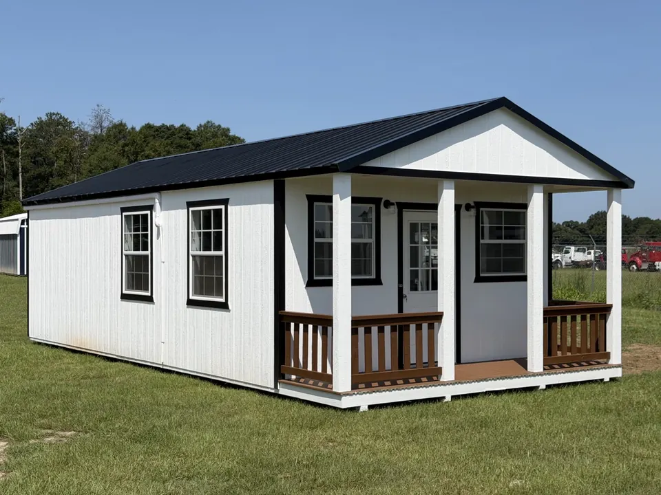 White porch cabin from the side