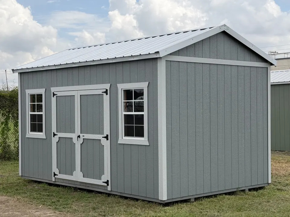 Real Utility shed with white trim and double doors